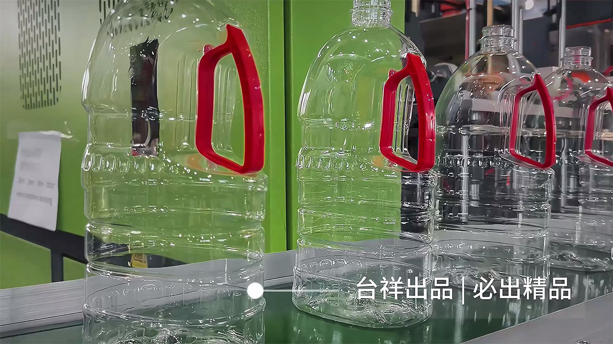 Production Challenges and Breakthroughs for Handle-Equipped PET Oil Bottles: TAIXAIGN's Customized Blow Molding Solutions